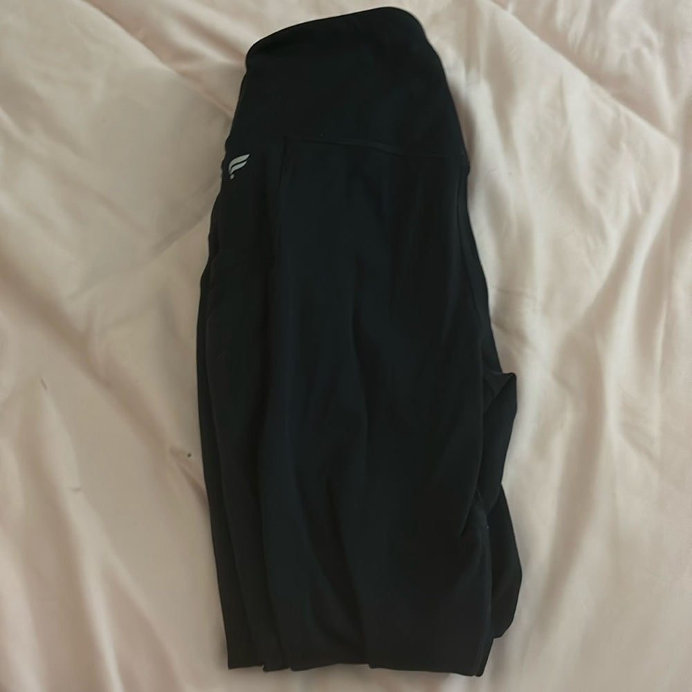 Three pairs of black small fabletics leggings